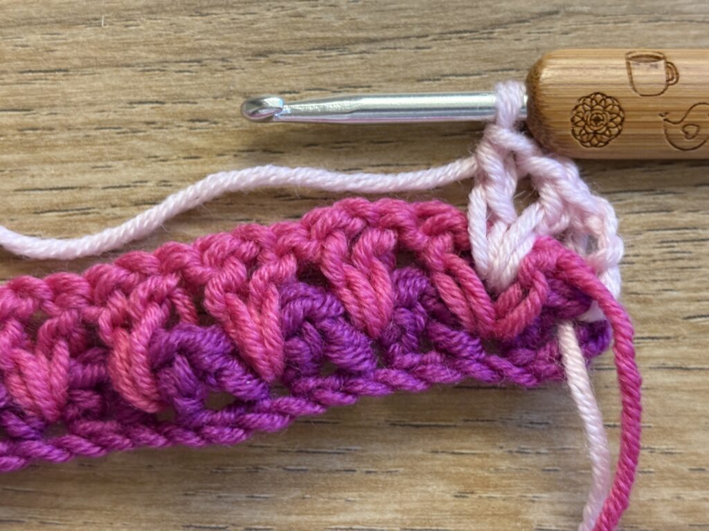 Genestelde V steek stap 24